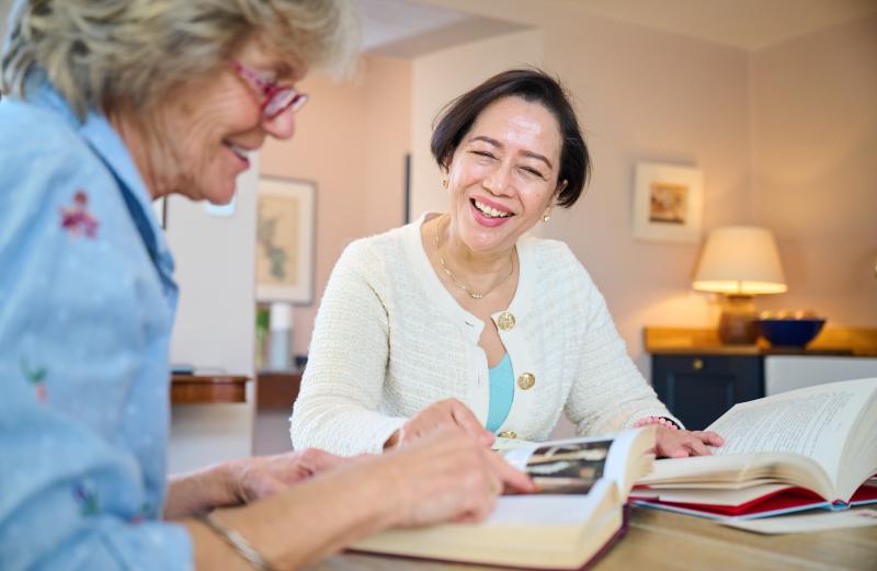 Friends looking through a book